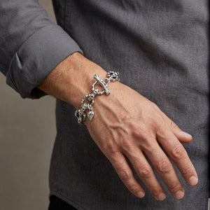 Skeleton bone link silver bracelet worn on a wrist