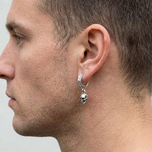 SKULL BLOOD silver crescent hoop with dangling skull on a male ear