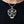 Skull and Crossbones Sterling Silver Guitar Pick Holder with black pick inserted inside