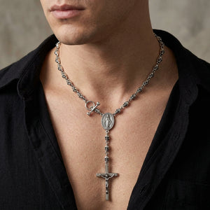 Skull bead crucifix silver rosary necklace worn at the neckline