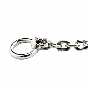 Panserarmbånd i sterlingsølv med hodeskalle-stavlås som viser den lille hodeskallen under mottakerringen og det stemplede leddet.