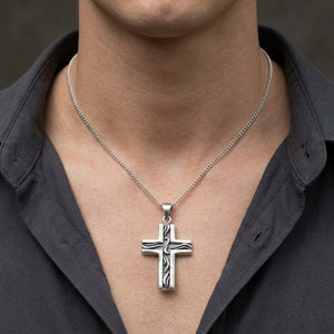 Small Tribal Cross Sterling Silver Pendant, worn on a neutral styling chain from chin down with collarbones, shoulders and upper chest visible; chain not included