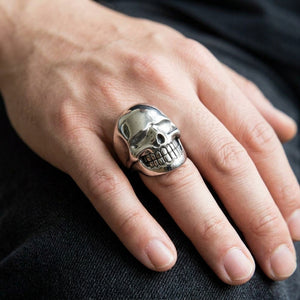 Smooth Skull Sterling Silver Ring worn on a hand