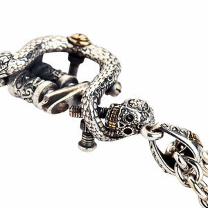 Snake and Skull Tattoo Machine Silver Pendant shown in skull and eye bail view.