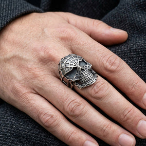 Spiderweb Skull Sterling Silver Ring worn on an adult hand