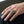 Star Cross Filigree Sterling Silver Gothic Ring, worn on one middle finger in a natural hand close-up