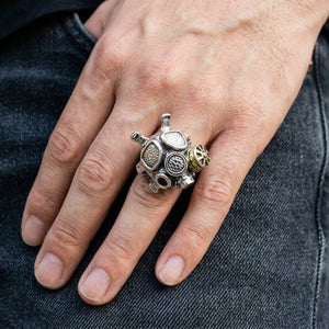Steampunk Gas Mask Sterling Silver Ring worn on an adult hand, showing the face and shoulder detail.