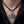 Blue eyeball pendant with silver claw setting on black braided leather cord necklace worn on model's neck, gothic biker jewel