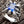 A men's solid sterling silver ring featuring four monstrous claws clutching a massive, square-cut blue sapphire CZ stone.
