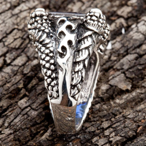 The side profile of the gothic claw ring, showcasing the intricate flame motif carved on the band.