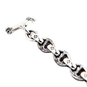 Detail shot of 925 hallmark stamp on T-bar clasp with lion paw design and Maltese cross links