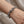 Sterling silver lion head bracelet worn on wrist showing fit and scale of cross link chain design
