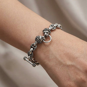 Sterling silver lion head bracelet worn on wrist showing fit and scale of cross link chain design