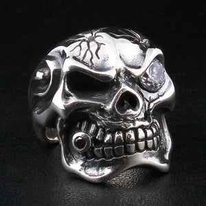 Sterling silver mafia skull ring with garnet and clear cz — front view