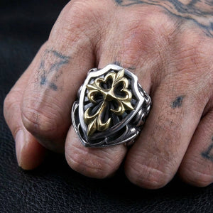Sterling silver medieval shield ring with a gold-plated cross worn on hand for scale
