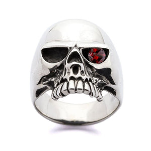Sterling silver skull ring with a garnet eye — front view