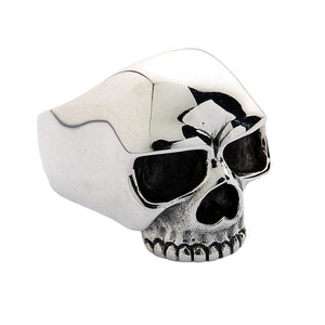 Opposite angled view of the silver skull ring showing its brow, dark eye sockets and cheekbones.