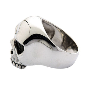 Rear side angle of the silver skull ring showing the polished band and curved interior.