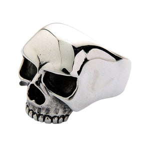 Side profile of the silver skull ring showing the smooth dome and broad polished shoulder.