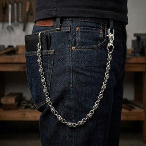 Sterling silver Slash Flame skull wallet chain clipped to dark jeans and a black leather wallet