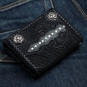 Black Stingray Cross Trifold with Silver Flame Snaps showing the stingray cross and two silver snaps viewed diagonally.