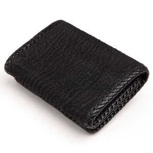 Black Stingray Cross Trifold with Silver Flame Snaps showing the plain black rear and braided edges.