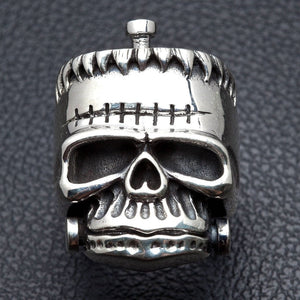 Stitched Skull-ring i 925 sterlingsilver, frontvy av skallens stygn och käkbultar