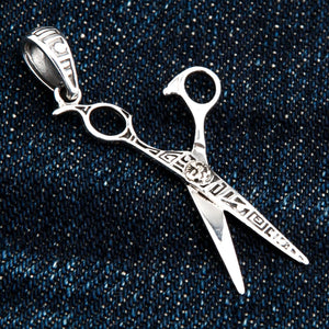 Engraved Scissors Sterling Silver Pendant shown in sun and geometric detail view.
