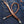 Tan Braided Leather Wallet Chain with Tassels, extended on denim