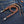 Tan Braided Leather Wallet Chain with Tassels, round on denim