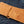 Tan Full-Quill Ostrich Leather Bifold Wallet showing the cowhide card rows inside the wallet on denim.