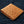 Tan Full-Quill Ostrich Leather Bifold Wallet showing tan ostrich quill texture across the front at an angle.
