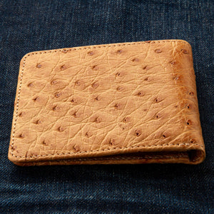 Tan Full-Quill Ostrich Leather Bifold Wallet showing the tan full-quill front and matching stitched edge.