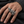 Three-Coil CZ Eye Sterling Silver Dragon Ring with its horned CZ-eye head and scaled coils along an adult finger.