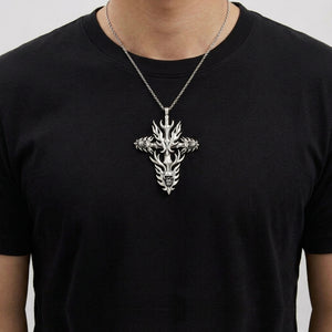 Three-Skull Flame Cross Sterling Silver Pendant worn on a short chain over a black shirt