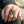 Green-Eye Tibetan Skull Sterling Silver Ring, worn on an adult hand