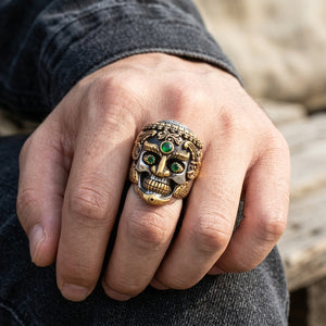 Green-Eye Tibetan Skull Sterling Silver Ring, worn on an adult hand