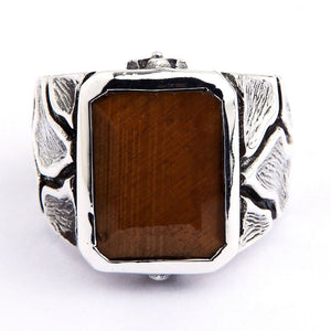 Tiger's Eye Ring with Textured Sterling Silver Band. Golden-brown tiger's eye sits above a textured silver band.