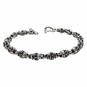 Bracelet tribal à maillons cylindriques en argent massif — vue en biais