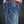 Tribal Roller silver wallet chain worn on blue jeans, showing its full drape
