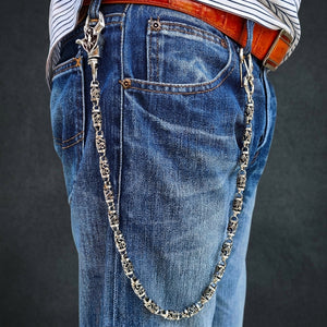 Tribal Roller silver wallet chain worn on blue jeans, showing its full drape