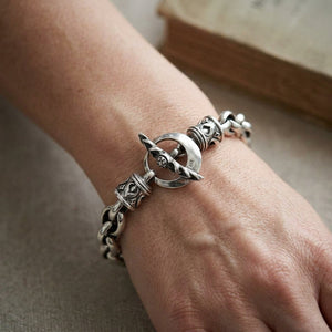 Tribal toggle silver chain bracelet worn on a wrist