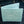 Turquoise Stingray Leather Bifold Wallet — open on denim front