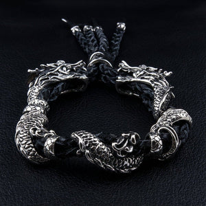 Twin Dragon Sterling Silver Leather Bracelet, dragon head detail viewed from above