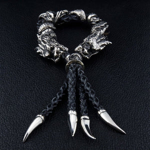 Twin Dragon Sterling Silver Leather Bracelet, front view of dragon heads and claw tassels