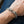 Twin Wolf Head Sterling Silver Curb Bracelet worn on an adult wrist, showing twin wolf heads and curb links.