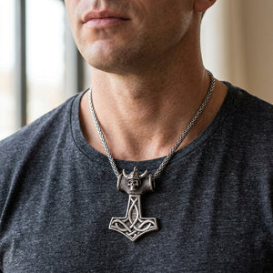 Viking skull hammer silver pendant worn on a model