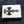 White Leather Black Stingray Cross Wallet, closed front on denim
