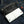 White Scorpion Stingray Leather Biker Wallet, partly open denim