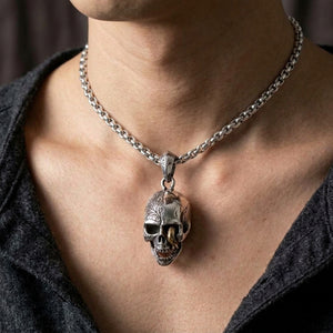 Worm skull silver and brass pendant worn on a 4 mm sterling silver chain